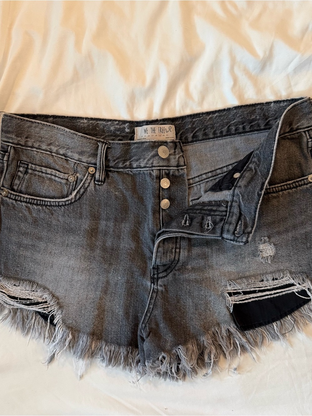 We The Free Washed Black Distressed Denim Cutoff Shorts